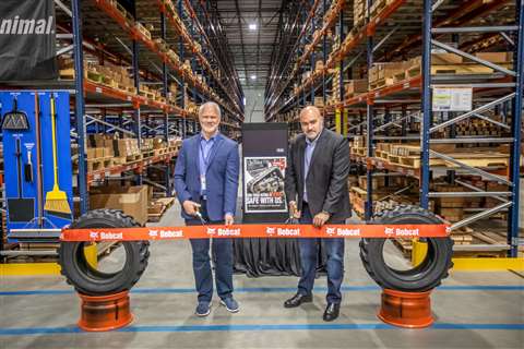 Mike Ballweber, president of Bobcat North America and Fabio Duque, regional vice president Americas cutting the ribbon.